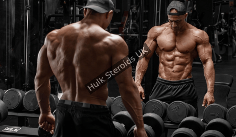 Physique athlete analyzing performance recovery and sustainable training progression